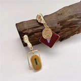 boucles-doreilles-vintage-asymetriques-en-metal