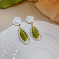 boucles-doreilles-oeil-de-chat-vert-vintage